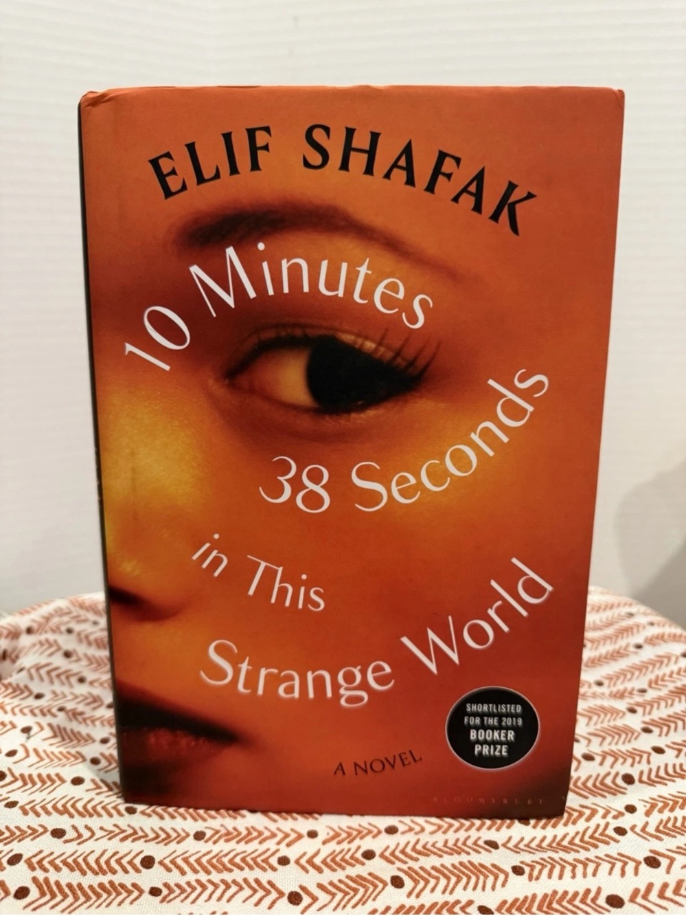 10 Minutes 38 Seconds in This Strange World by Elif Shafak - Orange Hardcover